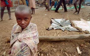 A young girl fleeing the war-ravaged Rwandan capital Kigali in1994.