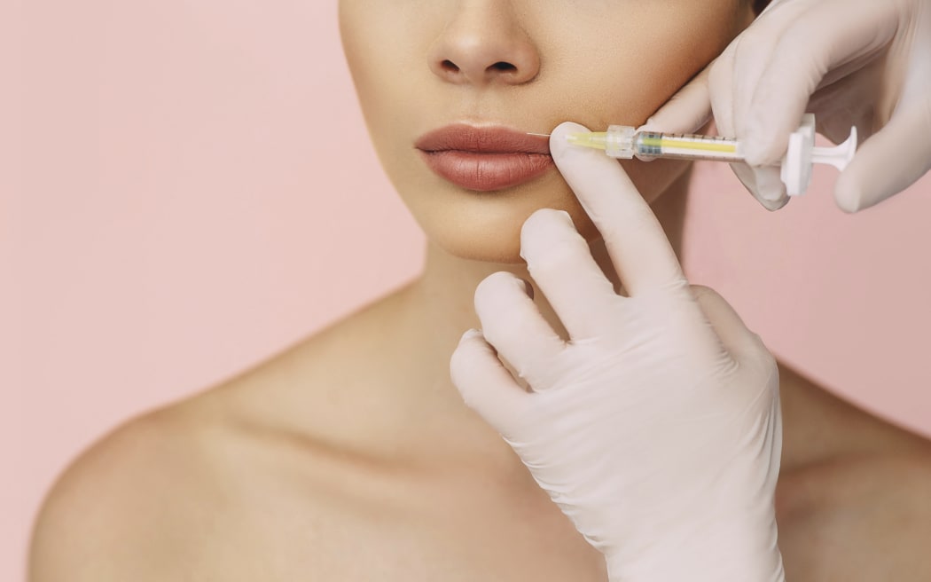 Lip augmentation injection.