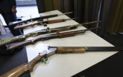 Firearms that will remain legal, depending on number of rounds and magazine type, on display at the police press conference.