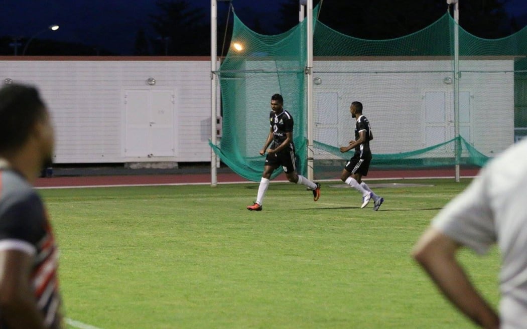 Ba celebrate the winning goal as Puaikura FC look on.