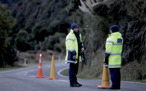 Police have set up checkpoints around Marokopa in the King Country as they step up the search for Tom Phillips and his three children, 13 June 2024.