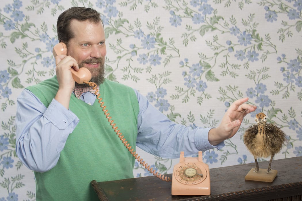John Grant with phone and ostrich