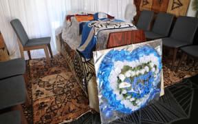 Fa'asala Sam Matue's coffin, with jerseys from his favourite teams