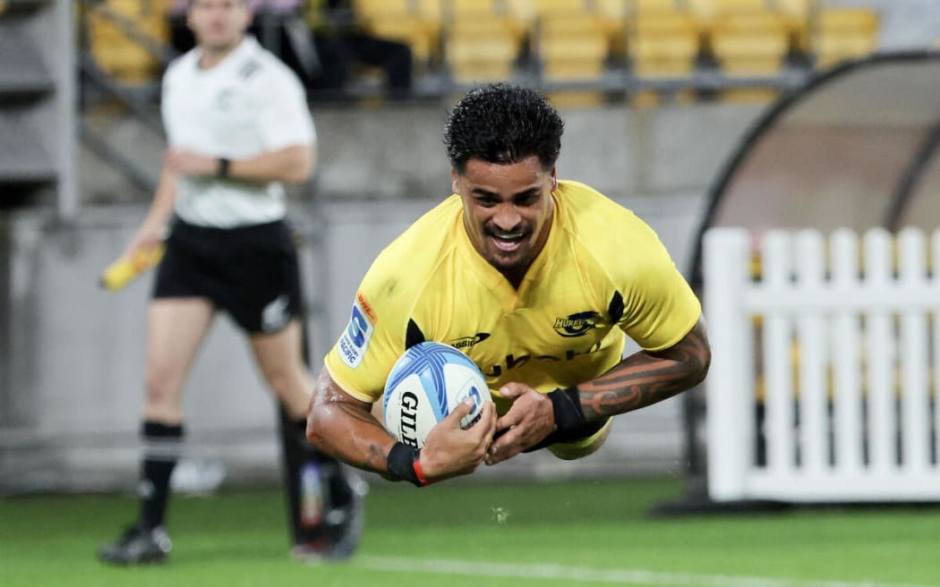 Bailyn Sullivan scores a try during the Hurricanes v Chiefs.
