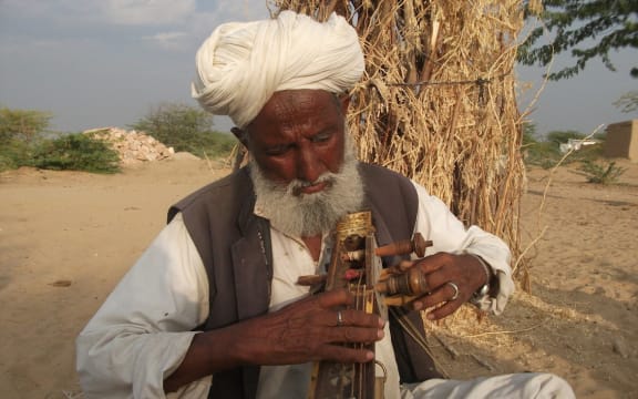 Hindal Khan from Dhantal village plays the kamaicha