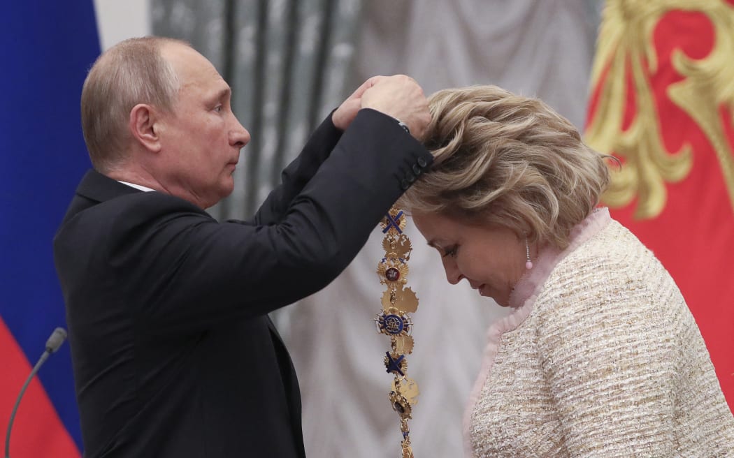 Russia's President Vladimir Putin awards the Order of St Andrew the Apostle to chairwoman of the Federation Council Valentina Matviyenko during a ceremony at the Kremlin in Moscow on 23 May 2019.