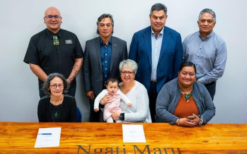 Ngāti Maru has worked for years towards settlement. (L-R) Raymond Tuuta (Trustee), Nathan Peri (Negotiator), Anaru Marshall (Lead Negotiator), Sam Tamarapa (Trustee), Rowena Henry (Advisory Trustee), Eileen Hall (Trustee) and mokopuna Sade, Tamzyn-Rose Pue (Te Tumu Ahurea).