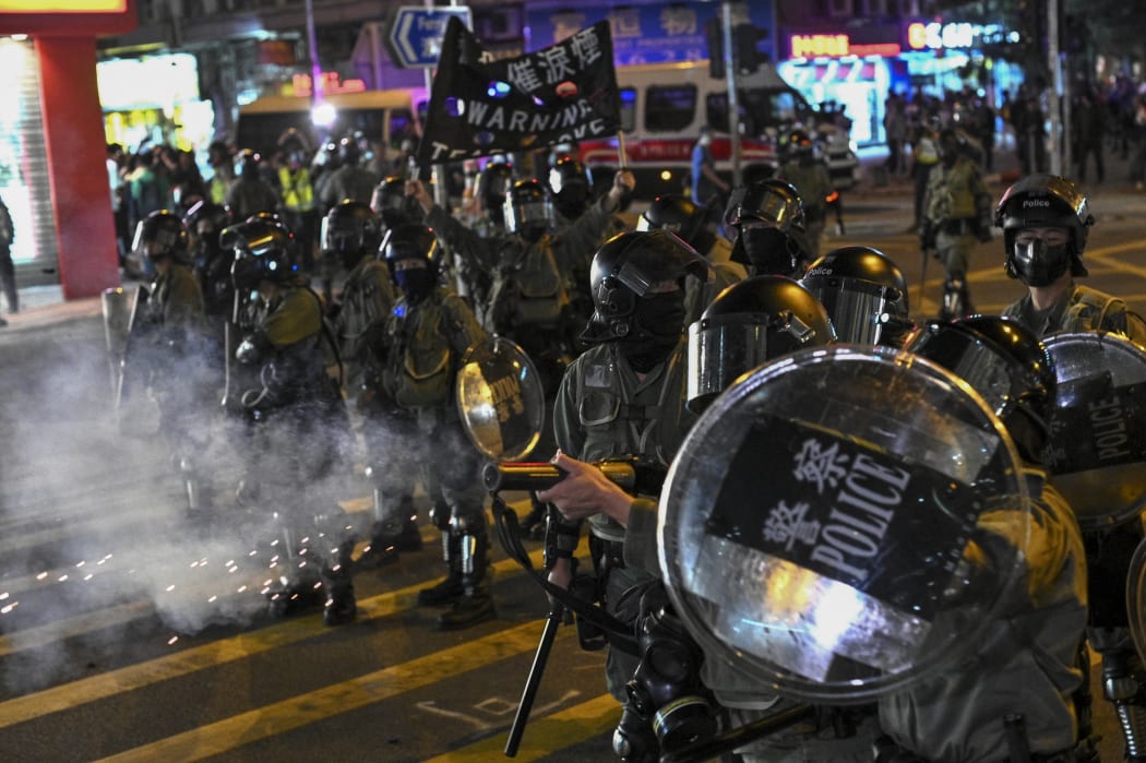 Police fire tear gas during a protest at Hung Hom area in Hong Kong on December 1, 2019.
