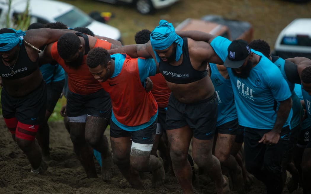 The Fiji team walk up the Sigatoka sand dunes.
