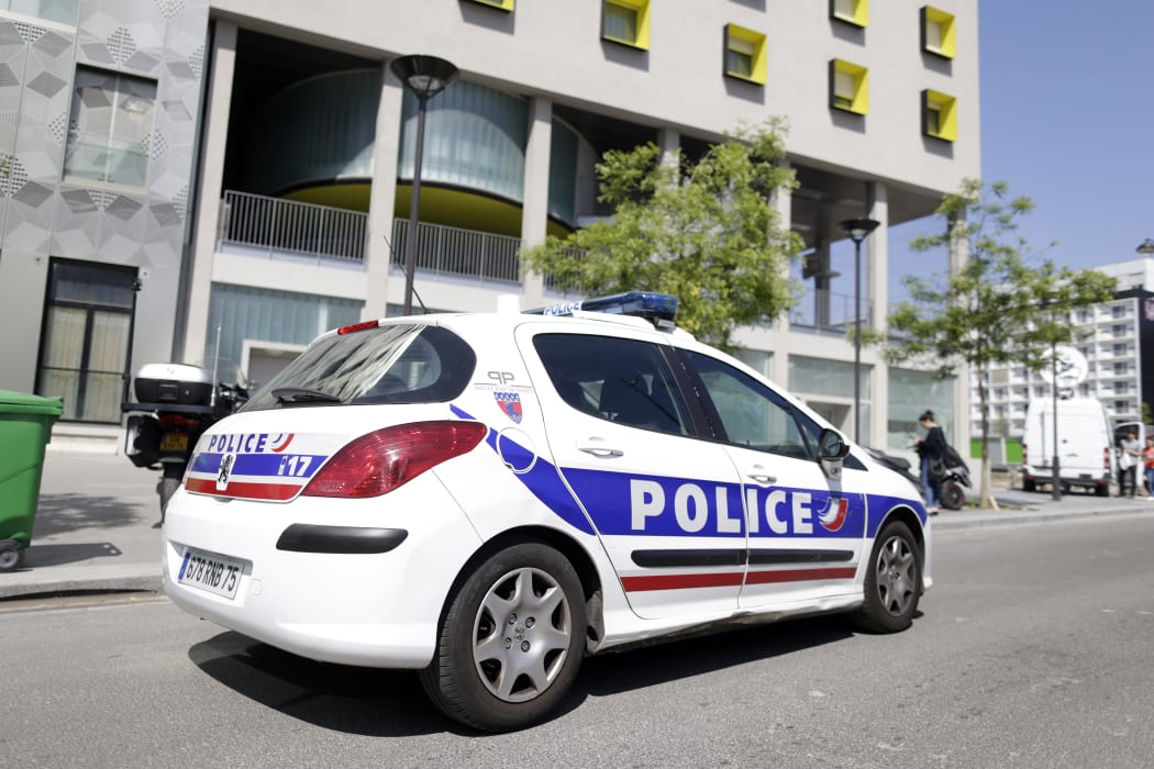 A police vehicle parked outside a student residence in Paris on 22 April 2015.