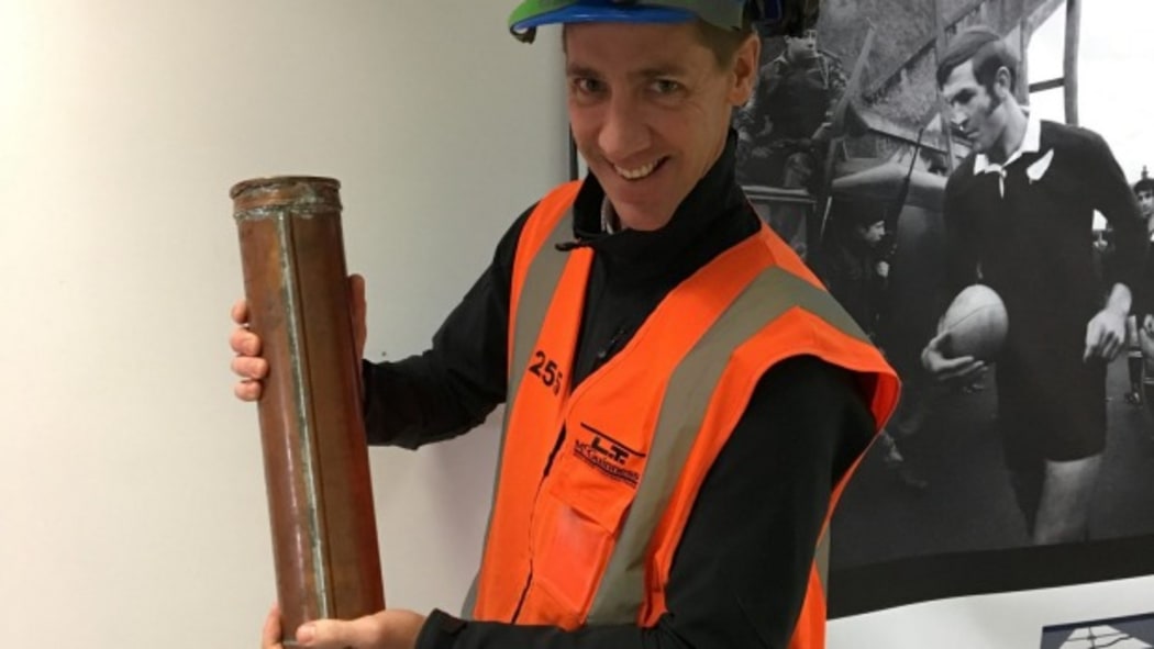 LT McGuiness surveyor Russell Mulder with the time capsule