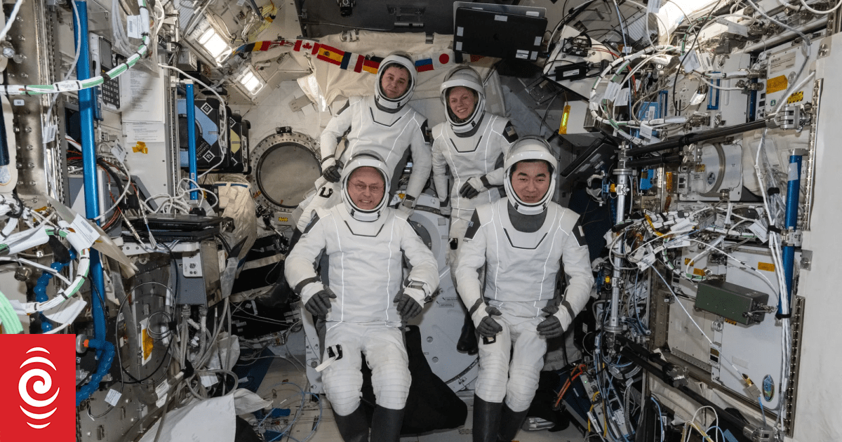 Four space station crewmates, one ailing, begin emergency return flight