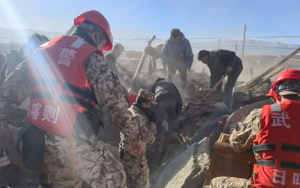(250107) -- LHASA, Jan. 7, 2025 (Xinhua) -- Rescuers search for survivors in Changsuo Township of Dingri County in Xigaze, southwest China's Xizang Autonomous Region, Jan. 7, 2025. A total of 95 people have been confirmed dead and 130 others injured as of 3 p.m. Tuesday, after a 6.8-magnitude earthquake jolted Dingri County in the city of Xigaze in southwest China's Xizang Autonomous Region at 9:05 a.m. Tuesday (Beijing Time). (Photo by Liu Yousheng/Xinhua) (Photo by Liu Yousheng / XINHUA / Xinhua via AFP)