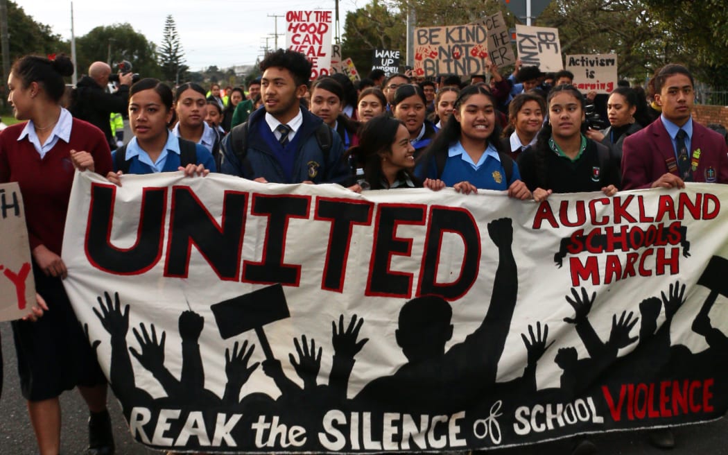Students from different schools lead the march against school violence in Auckland
