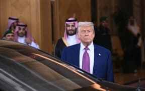 Crown Prince Mohammed bin Salman (C-L) looks on as US President Donald Trump departs after a bilateral meeting in Riyadh on May 13, 2025. The US and Saudi Arabia signed a mammoth arms deal on May 13 that the White House called the largest "in history" amid a raft of agreements inked by Donald Trump and Saudi Crown Prince Mohammed bin Salman in Riyadh. (Photo by Brendan SMIALOWSKI / AFP)