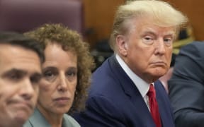 NEW YORK, NEW YORK - APRIL 04: Former U.S. President Donald Trump sits at the defense table with his defense team in a Manhattan court during his arraignment on April 4, 2023, in New York City. Trump was arraigned during his first court appearance today following an indictment by a grand jury that heard evidence about money paid to adult film star Stormy Daniels before the 2016 presidential election. With the indictment, Trump becomes the first former U.S. president in history to be charged with a criminal offense.   Seth Wenig-Pool/Getty Images/AFP (Photo by POOL / GETTY IMAGES NORTH AMERICA / Getty Images via AFP)