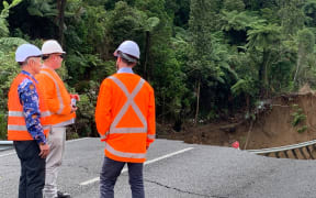 Thames-Coromandel mayor Len Salt, left, and Emergency Management Minister Kieran McAnulty at the site of the massive landslide that destroyed part of State Highway 25A.