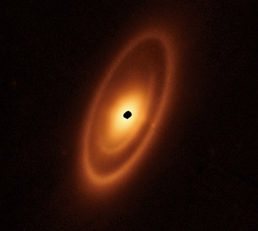 The dusty debris disk surrounding the young star Fomalhaut encompasses three nested belts extending out to 23 billion kilometres from the star.