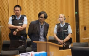 Tingjun Cao in the dock of the Christchurch High Court facing the jury on a charge of murder relating to real estate agent Yanfei Bao. Credit: Peter Meecham/The Press
