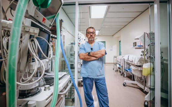 Dr Alberto Ramirez - lead anaesthetist at Palmerston North hospital - stands in corridor used to store expensive equipment.