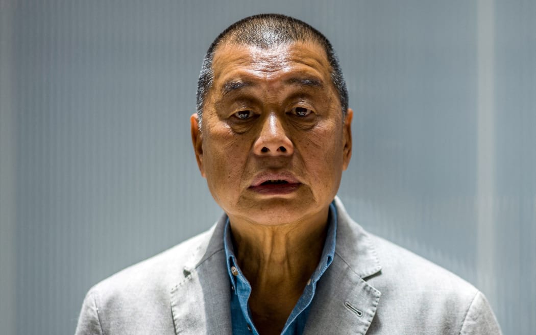 (FILES) In this file photo taken on June 16, 2020, millionaire media tycoon Jimmy Lai, 72, poses during an interview with AFP at the Next Digital offices in Hong Kong.