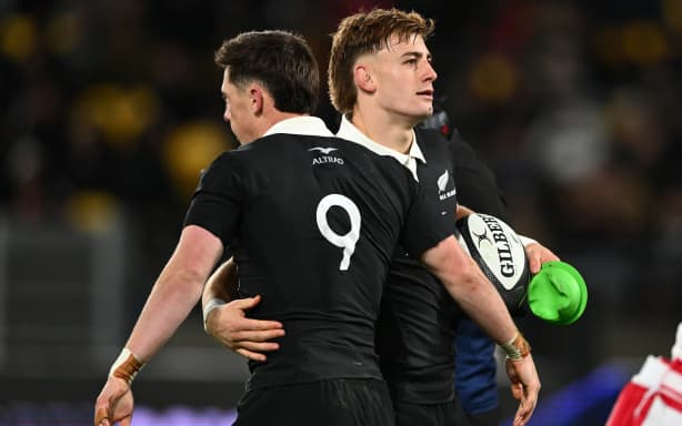 Cam Roigard celebrates his try with Ruben Love.