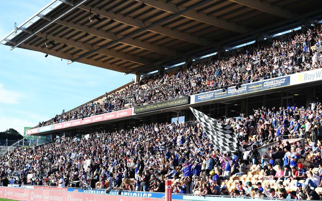 General view of the Eastern Stand with fans and supporters.