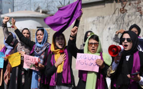 A group of women stage a rally calling on the Taliban to ensure equal rights in the country and allow them to be contributing members of Afghan society, in Kabul.