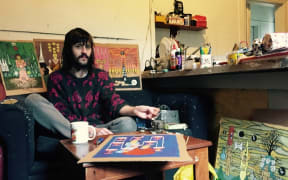 Casey Latimer of GPOGP with his tarot works.