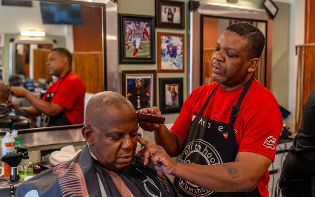 Maurice Combs has a barber shop in Atlanta, Georgia.