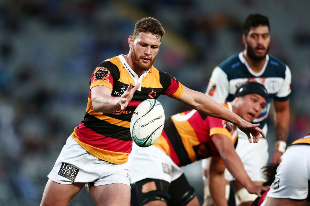 Tawera Kerr-Barlow of Waikato puts in a kick in Mitre 10 Cup match against Auckland