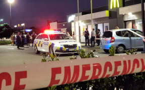 Police at the scene of an assault at McDonald's on Stoddard Road in Auckland's Mount Roskill on 11 January 2024.