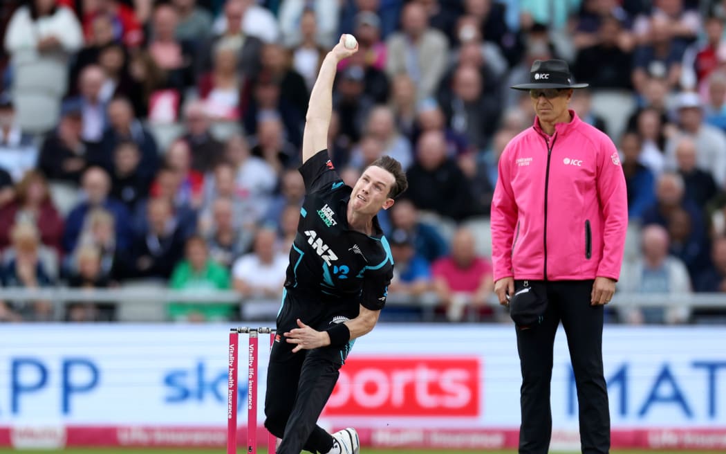 Adam Milne of New Zealand bowling