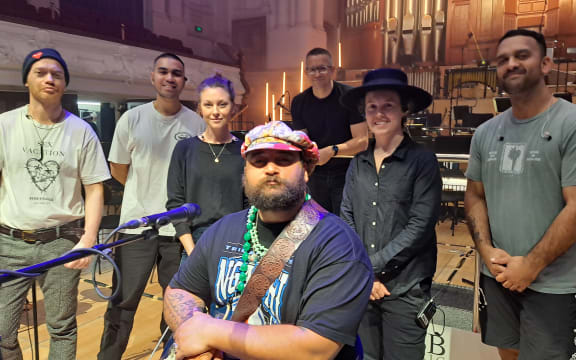 Troy Kingi and Band on stage of the Auckland Town Hall.