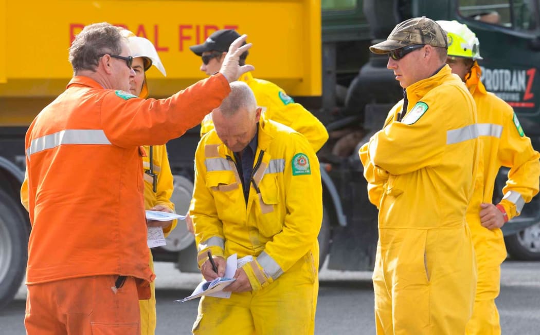 Firefighters and civil defence staff are briefed.