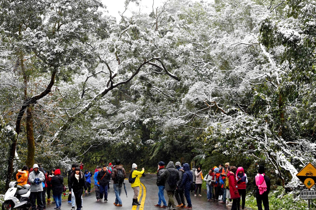 Some mountain areas in Taiwan saw snow fall as the worst cold wave in 10 years hit the island.
