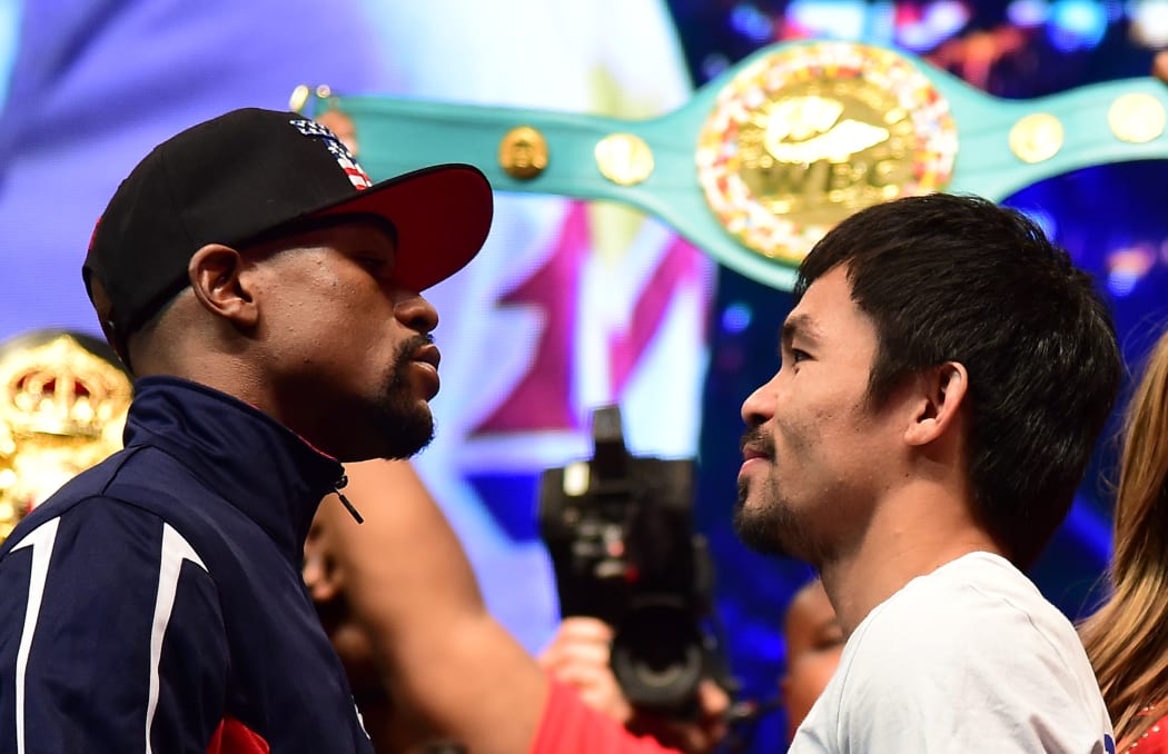 Floyd Mayweather and Manny Pacquiao face off following their weigh-in in Las Vegas