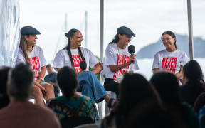 A group of rangatahi that were involved in Hīkoi mō te Tiriti speak at the Waitangi Forum Tent, February 2025.