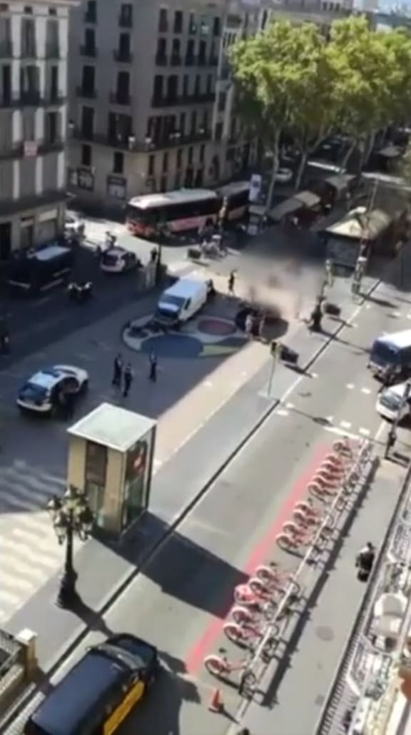 The white van at the centre of the attack can be seen surrounded by officers.