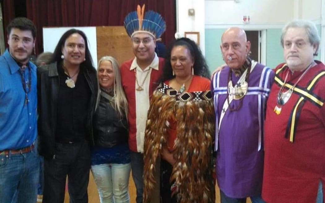 Doreen Bennett wearing cloak, centre, with Mashu White Feather in purple shirt and First Nations Tribal leaders from East Haven in Connecticut.