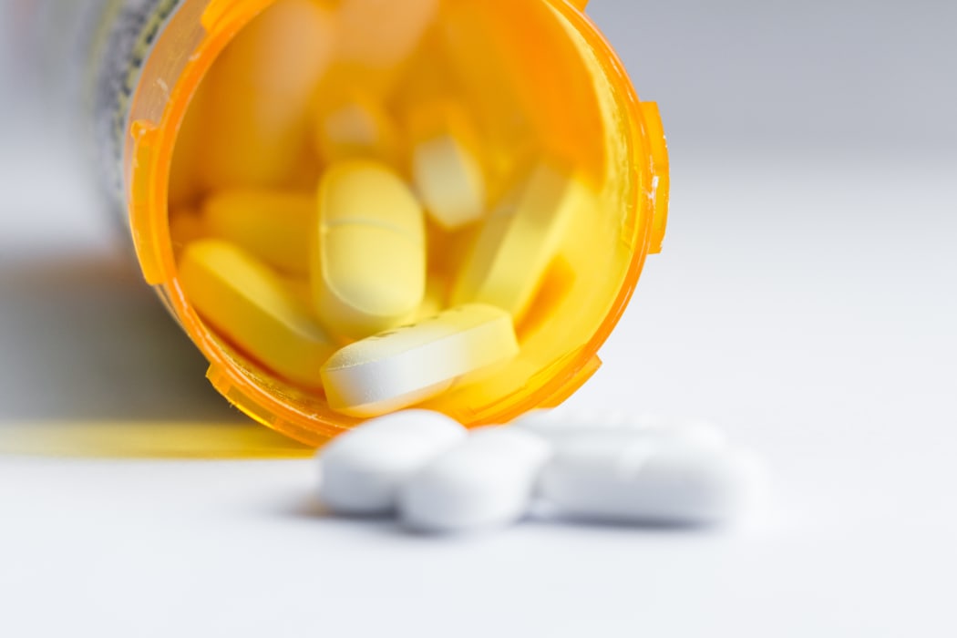 Tablets with prescription bottle.
