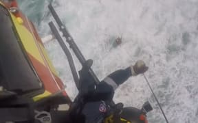 A man was winched to safety by a rescue helicopter after being stranded for two hours.