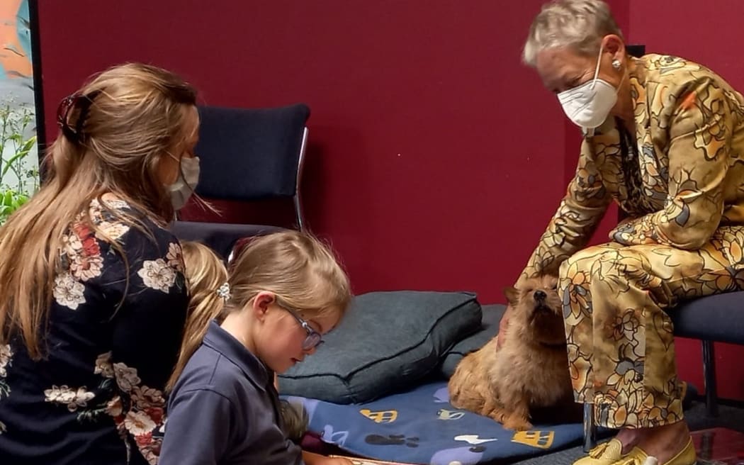 Jill and her dog Riff Raff in the children's library.