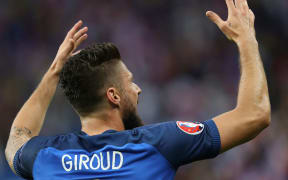 France's Olivier Giroud celebrates scoring a goal against Iceland.