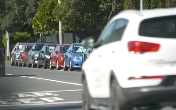 Cars parked on an Auckland road.