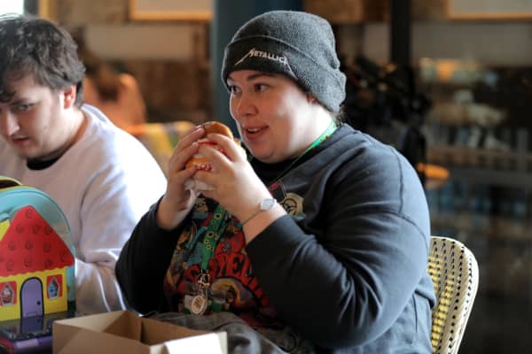 Sophie Gallagher enjoys a burger at the In-N-Out pop-up in downtown Auckland, June, 2025.