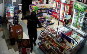 Video footage shows one of the offenders inside Aberdeen Superette.