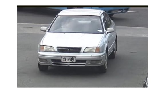 A silver Toyota Camry with the registration plate CLR45.