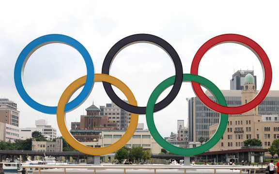 June 30, 2021, Yokohama, Japan - A large monument of the Olympic rings is displayed at a port city of Yokohama, suburban Tokyo on Wednesday, June 30, 2021 as the Olympic torch relay is held at the city.