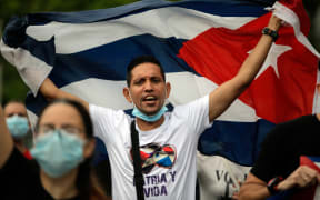 Cuban residents in Panama protest against the Cuban government near the Cuban Embassy in Panama City.